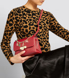 London Charms Red Cross Body Bag.  حقيبة باللون الأحمر من لندن تشارمز